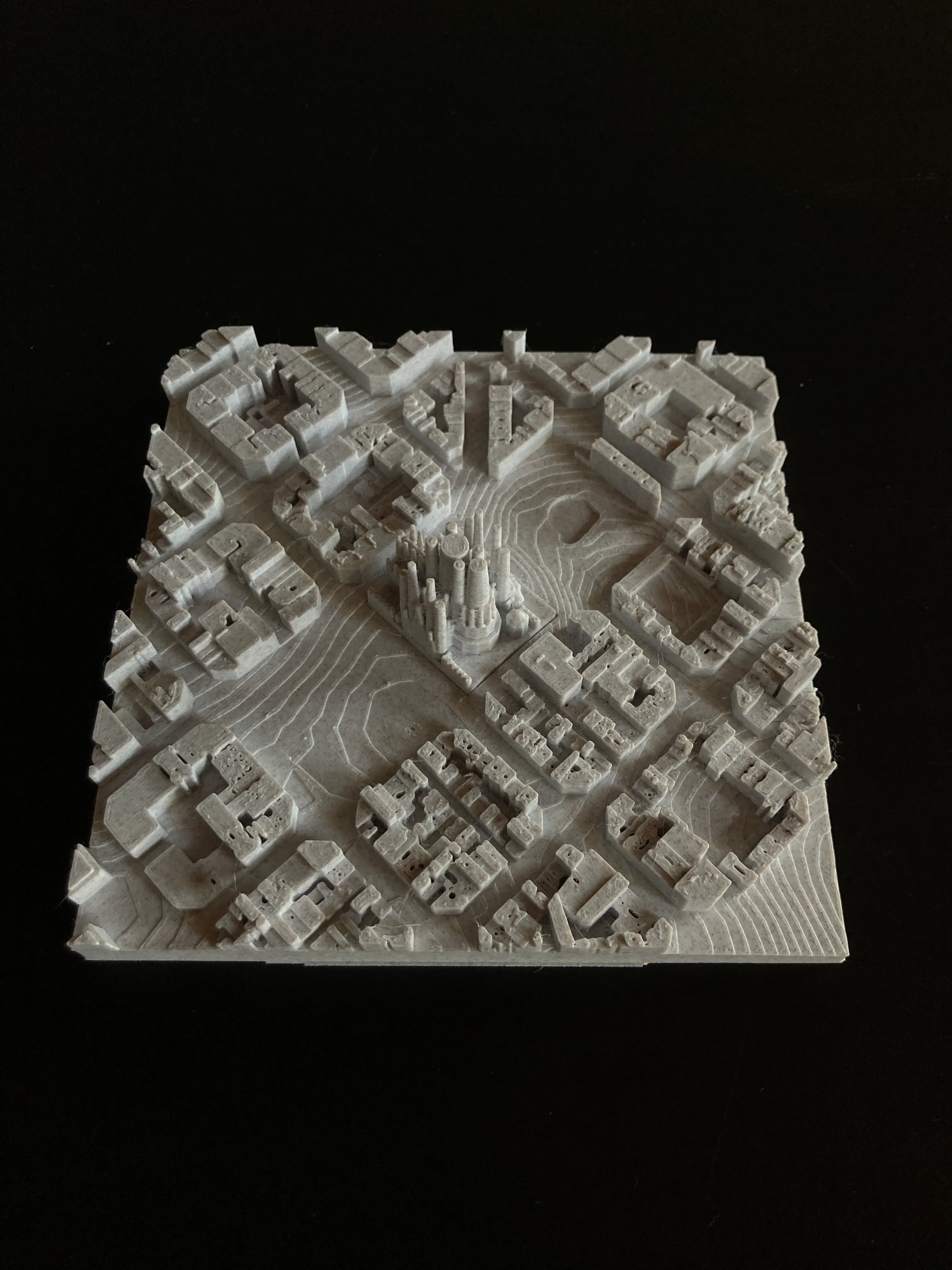 Single-colour white 3D printed relief map of a city centre