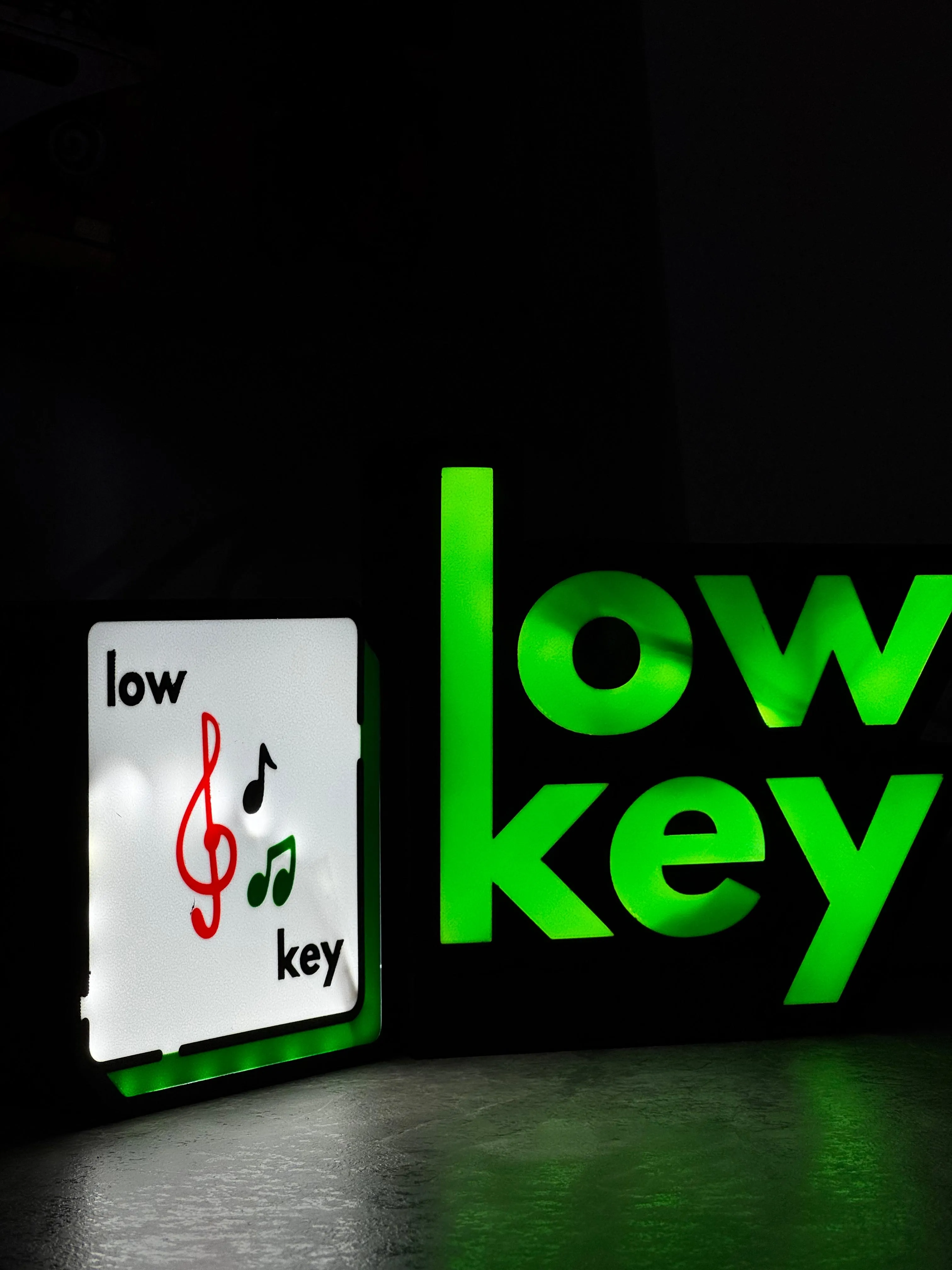 Low Key logo lightbox glowing green in the dark
